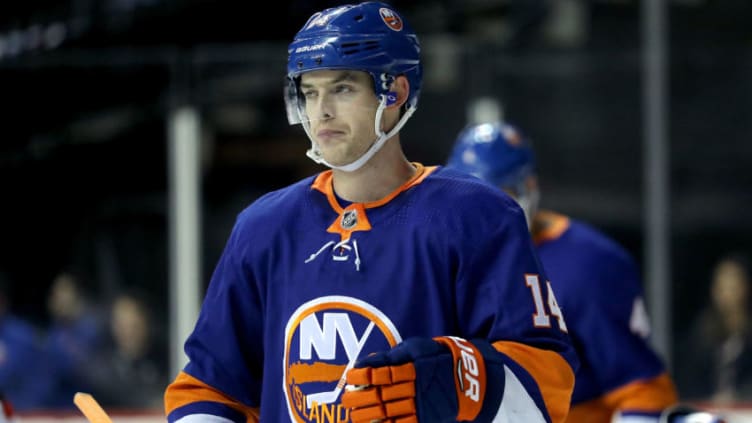 NEW YORK, NY - JANUARY 16: Thomas Hickey #14 of the New York Islanders reacts after a goal by Kyle Palmieri #21 of the New Jersey Devils in the first period during their game at Barclays Center on January 16, 2018 in the Brooklyn borough of New York City. (Photo by Abbie Parr/Getty Images)