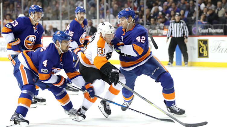 NEW YORK, NY - NOVEMBER 22: Valtteri Filppula #51 of the Philadelphia Flyers battles for the puck against members of the New York Islanders in the third period during their game at Barclays Center on November 22, 2017 in the Brooklyn borough of New York City. (Photo by Abbie Parr/Getty Images)