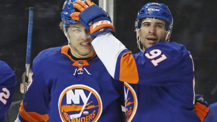 NEW YORK, NY - MARCH 22: John Tavares #91 of the New York Islanders congratulates Anders Lee #27 on his second period goal against the Tampa Bay Lightning at the Barclays Center on March 22, 2018 in the Brooklyn borough of New York City. (Photo by Bruce Bennett/Getty Images)