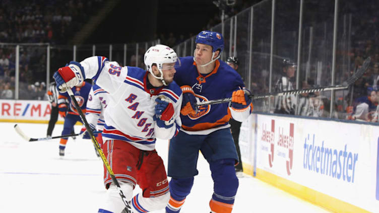 NEW YORK, NEW YORK - FEBRUARY 25: Ryan Lindgren #55 of the New York Rangers steps into Matt Martin #17 of the New York Islanders during the second period at NYCB Live's Nassau Coliseum on February 25, 2020 in Uniondale, New York. (Photo by Bruce Bennett/Getty Images)