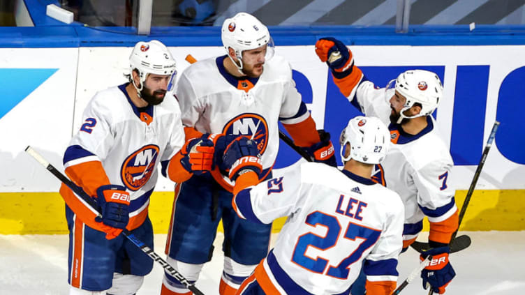 EDMONTON, ALBERTA - SEPTEMBER 15: Ryan Pulock #6 of the New York Islanders is congratulated by his teammates after scoring a goal against the Tampa Bay Lightning during the first period in Game Five of the Eastern Conference Final during the 2020 NHL Stanley Cup Playoffs at Rogers Place on September 15, 2020 in Edmonton, Alberta, Canada. (Photo by Bruce Bennett/Getty Images)