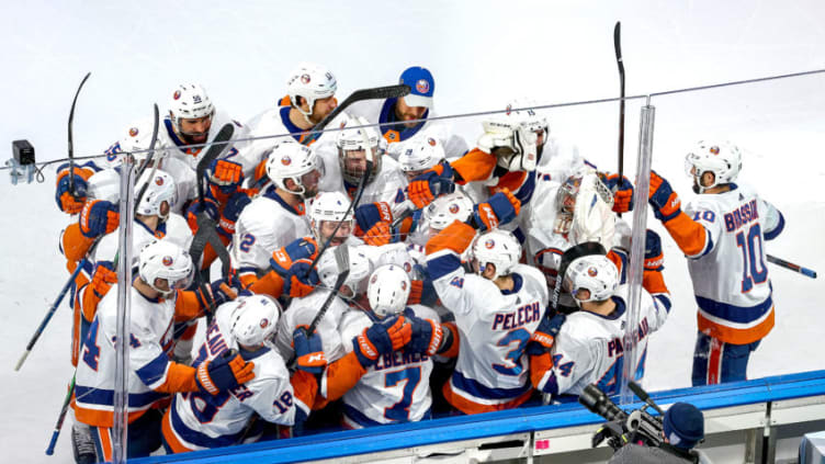 EDMONTON, ALBERTA - SEPTEMBER 15: Jordan Eberle #7 of the New York Islanders is congratulated by his teammates after scoring the game-winning goal against the Tampa Bay Lightning during the second overtime period to win Game Five of the Eastern Conference Final during the 2020 NHL Stanley Cup Playoffs at Rogers Place on September 15, 2020 in Edmonton, Alberta, Canada. (Photo by Bruce Bennett/Getty Images)