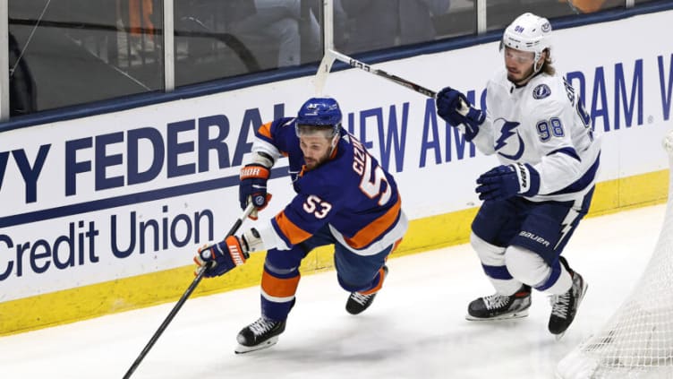 UNIONDALE, NEW YORK - JUNE 17: Casey Cizikas #53 of the New York Islanders is pursued by Mikhail Sergachev #98 of the Tampa Bay Lightning during the second period in Game Three of the Stanley Cup Semifinals during the 2021 Stanley Cup Playoffs at Nassau Coliseum on June 17, 2021 in Uniondale, New York. (Photo by Elsa/Getty Images)