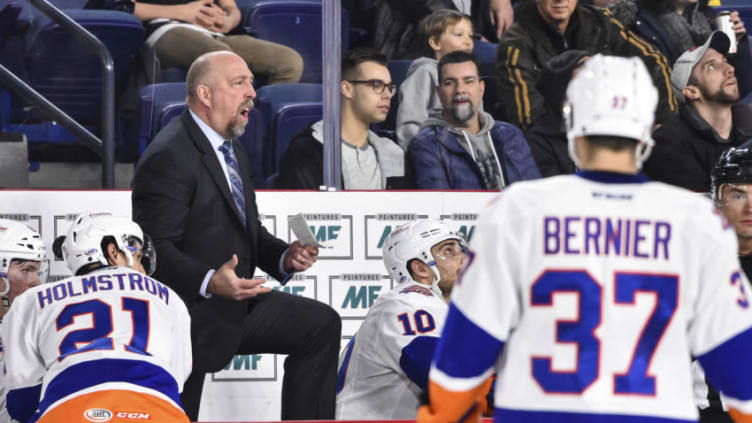 LAVAL, QC - MARCH 02: Head coach of the Bridgeport Sound Tigers Brent Thompson shows his frustration from behind the bench against the Laval Rocket during the AHL game at Place Bell on March 2, 2018 in Laval, Quebec, Canada. The Bridgeport Sound Tigers defeated the Laval Rocket 4-2. (Photo by Minas Panagiotakis/Getty Images)