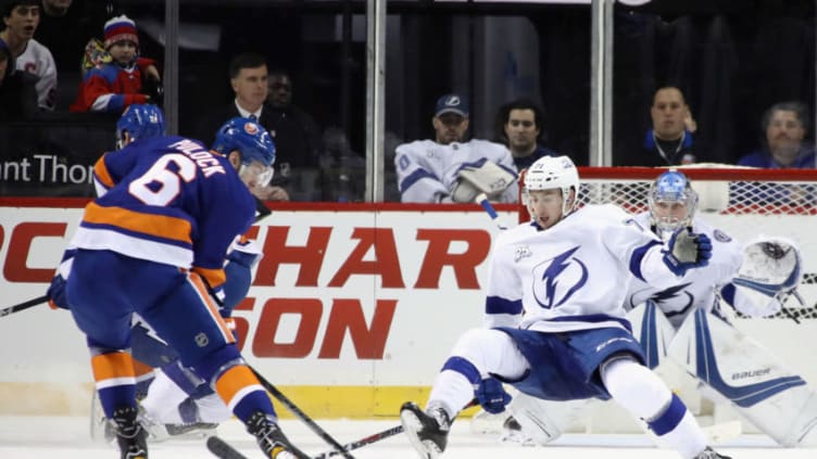 NEW YORK, NY - MARCH 22: Ryan Pulock #6 of the New York Islanders attempts to get the puck past Anthony Cirelli #71 of the Tampa Bay Lightning during the third period at the Barclays Center on March 22, 2018 in the Brooklyn borough of New York City. (Photo by Bruce Bennett/Getty Images)