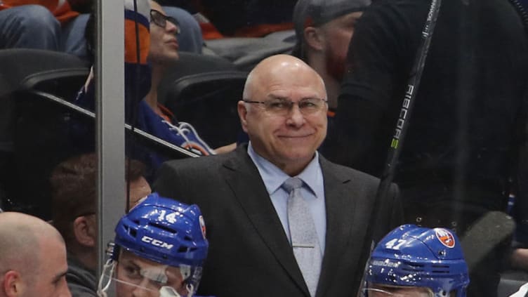 UNIONDALE, NEW YORK - MARCH 30: Barry Trotz of the New York Islanders handles bench duties against the Buffalo Sabres at NYCB Live's Nassau Coliseum on March 30, 2019 in Uniondale, New York. The Islanders defeated the Sabres 5-1 to qualify for the playoffs. (Photo by Bruce Bennett/Getty Images)