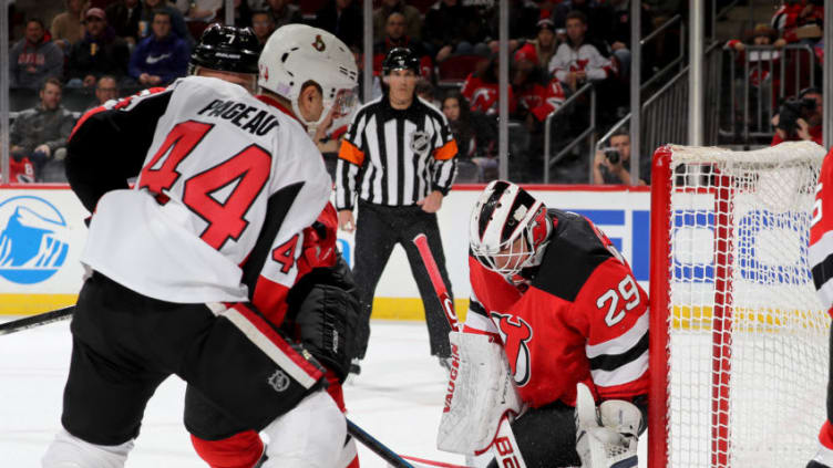 NEWARK, NEW JERSEY - NOVEMBER 13: Jean-Gabriel Pageau #44 of the Ottawa Senators gets the puck past Mackenzie Blackwood #29 of the New Jersey Devils in the first period at Prudential Center on November 13, 2019 in Newark, New Jersey. (Photo by Elsa/Getty Images)