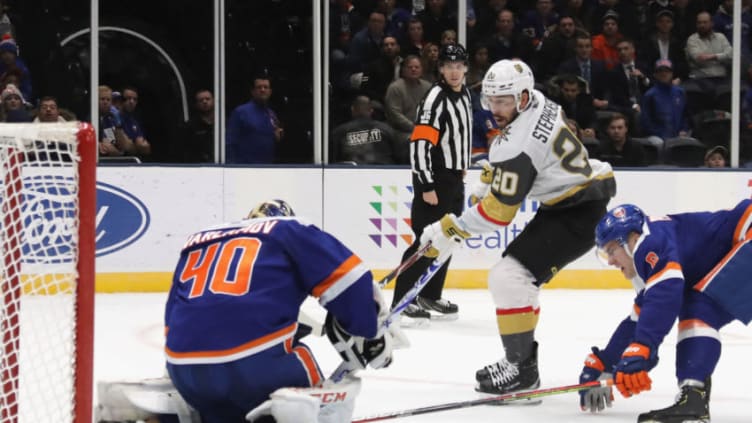 UNIONDALE, NEW YORK - DECEMBER 05: Chandler Stephenson #20 of the Vegas Golden Knights is stopped by Semyon Varlamov #40 of the New York Islanders during the first period at NYCB Live's Nassau Coliseum on December 05, 2019 in Uniondale, New York. (Photo by Bruce Bennett/Getty Images)