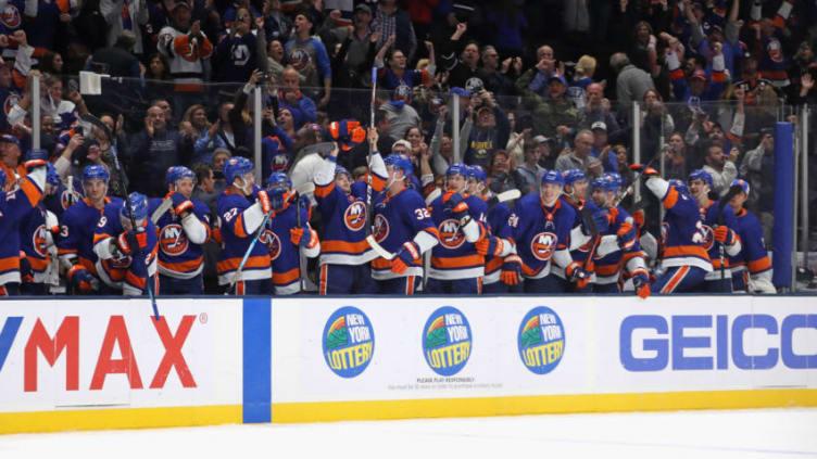 UNIONDALE, NEW YORK - OCTOBER 12: The New York Islanders celebrate a 3-2 shoot-out win against the Florida Panthers at NYCB Live's Nassau Coliseum on October 12, 2019 in Uniondale, New York. (Photo by Bruce Bennett/Getty Images)