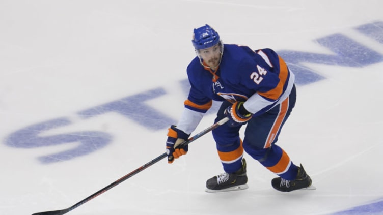 Aug 16, 2020; Toronto, Ontario, CAN; New York Islanders defenseman Scott Mayfield (24) controls the puck against the Washington Capitals during overtime of game three of the first round of the 2020 Stanley Cup Playoffs at Scotiabank Arena. Mandatory Credit: John E. Sokolowski-USA TODAY Sports