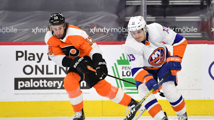 Jan 30, 2021; Philadelphia, Pennsylvania, USA; New York Islanders center Mathew Barzal (13) skates with the puck against Philadelphia Flyers center Kevin Hayes (13) during the first period at Wells Fargo Center. Mandatory Credit: Eric Hartline-USA TODAY Sports