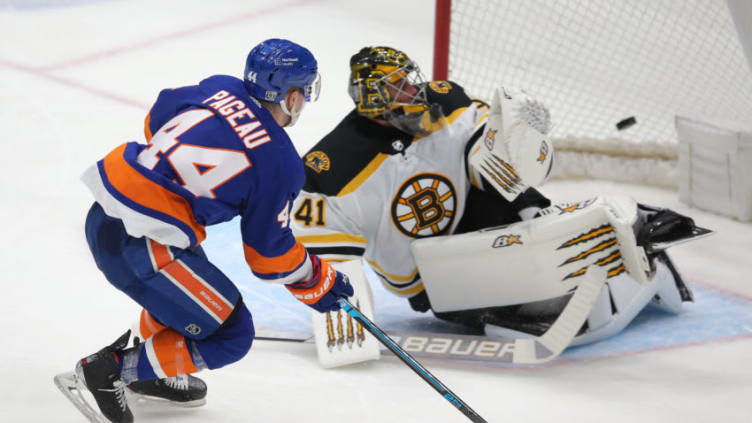 Feb 25, 2021; Uniondale, New York, USA; New York Islanders center Jean-Gabriel Pageau (44) scores a goal against Boston Bruins goalie Jaroslav Halak (41) during the third period at Nassau Veterans Memorial Coliseum. Mandatory Credit: Brad Penner-USA TODAY Sports