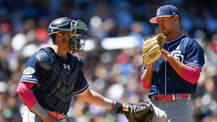 DENVER, CO - MAY 12: Austin Hedges #18 of the San Diego Padres visits Nick Margevicius #25 on the mound in the first inning of a game against the Colorado Rockies at Coors Field on May 12, 2019 in Denver, Colorado. (Photo by Dustin Bradford/Getty Images)