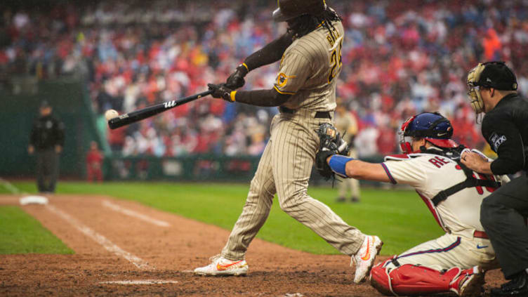 PHILADELPHIA, PENNSYLVANIA - OCTOBER 23: Josh Bell #24 of the San Diego Padres swings and hits the ball in the seventh inning of Game Five of the National League Championship Series against the Philadelphia Phillies at Citizens Bank Park on October 23, 2022 in Philadelphia, Pennsylvania. (Photo by Matt Thomas/San Diego Padres/Getty Images)