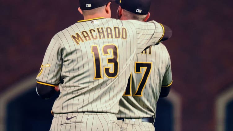 Aug 29, 2022; San Francisco, California, USA; San Diego Padres third baseman Manny Machado (13) puts his arm around first baseman Brandon Drury (17) after a win against the San Francisco Giants at Oracle Park. Mandatory Credit: Kelley L Cox-USA TODAY Sports