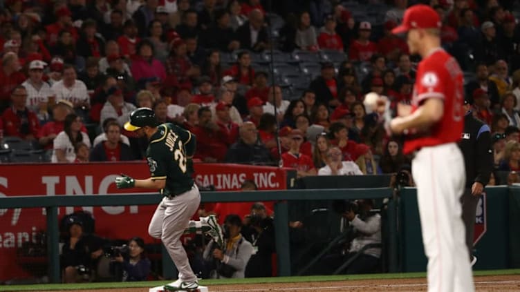 ANAHEIM, CA - APRIL 06: Matt Joyce #23 of the Oakland Athletics rounds third base on his way home after hitting a solo homerun against pitcher Parker Bridwell #62 of the Los Angeles Angels of Anaheim during the second inning of the MLB game at Angel Stadium on April 6, 2018 in Anaheim, California. (Photo by Victor Decolongon/Getty Images)