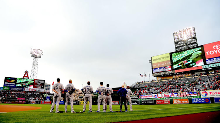 ANAHEIM, CA - MAY 19: The Los Angeles Dodgers line up for the National Anthem before the game against the Los Angeles Angels at Angel Stadium of Anaheim on May 19, 2016 in Anaheim, California. (Photo by Harry How/Getty Images)