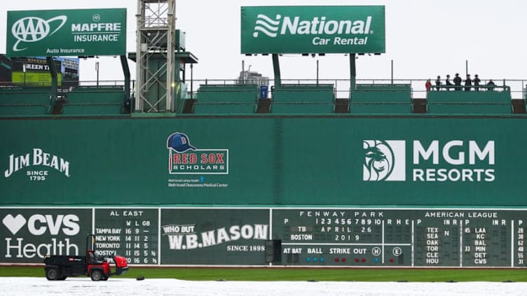 BOSTON, MA - APRIL 26: A general view of the Green Monster as the tarp covers the field after the game between the Boston Red Sox and the Tampa Bay Rays was postponed due to rain at Fenway Park on April 26, 2019 in Boston, Massachusetts. (Photo by Adam Glanzman/Getty Images)