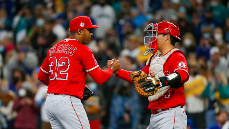 Raisel Iglesias, Kurt Suzuki, LA Angels. Mandatory Credit: Joe Nicholson-USA TODAY Sports