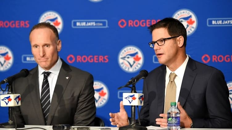 Dec 4, 2015; Toronto, Ontario, Canada; Toronto Blue Jays new general manager Ross Atkins (right) answers questions along with club president Mark Shapiro during an introductory media conference at Rogers Centre. Mandatory Credit: Dan Hamilton-USA TODAY Sports