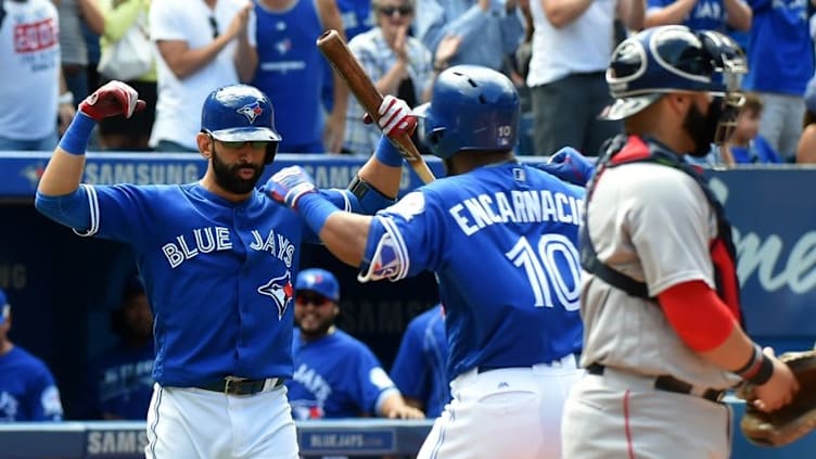 Sep 11, 2016; Toronto, Ontario, CAN; Toronto Blue Jays first baseman Edwin Encarnacion (10) is greeted by right fielder Jose Bautista (19) after hitting a two run home run against the Boston Red Sox in the fourth inning at Rogers Centre. Mandatory Credit: Dan Hamilton-USA TODAY Sports