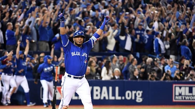 Oct 4, 2016; Toronto, Ontario, CAN; Toronto Blue Jays designated hitter Edwin Encarnacion (10) hits a walk off home run to beat the Baltimore Orioles during the eleventh inning in the American League wild card playoff baseball game at Rogers Centre. Mandatory Credit: Nick Turchiaro-USA TODAY Sports