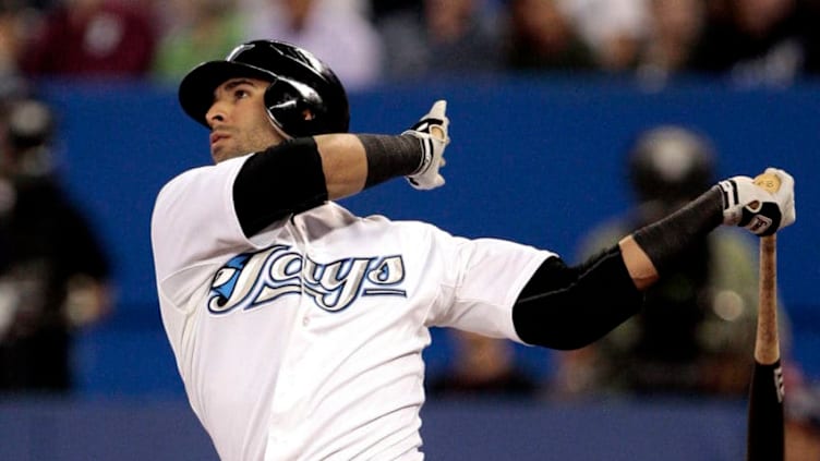 TORONTO, CANADA - AUGUST 29: Jose Bautista #19 of the Toronto Blue Jays hits a home run against the Tampa Bay Rays during MLB action at the Rogers Centre August 29, 2011 in Toronto, Ontario, Canada. (Photo by Abelimages/Getty Images)