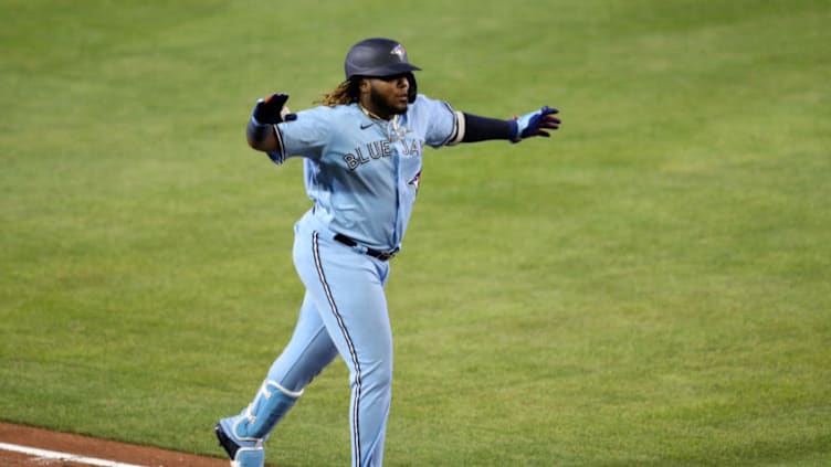 BUFFALO, NEW YORK - AUGUST 12: Vladimir Guerrero Jr. #27 of the Toronto Blue Jays runs the bases after hitting a two run home run during the seventh inning of an MLB game against the Miami Marlins at Sahlen Field on August 12, 2020 in Buffalo, New York. The Blue Jays are the home team and are playing their home games in Buffalo due to the Canadian government’s policy on COVID-19. (Photo by Bryan M. Bennett/Getty Images)