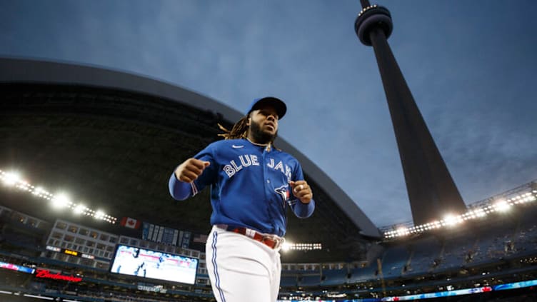 TORONTO, ON - SEPTEMBER 30: Vladimir Guerrero Jr. #27 of the Toronto Blue Jaysheads into the dugout ahead of their MLB game against the New York Yankees at Rogers Centre on September 30, 2021 in Toronto, Ontario. (Photo by Cole Burston/Getty Images)