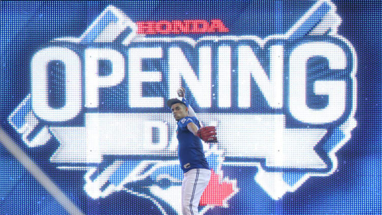 TORONTO, ON - MARCH 29: Roberto Osuna #54 of the Toronto Blue Jays warms up in the outfield on Opening Day before their MLB game against the New York Yankees at Rogers Centre on March 29, 2018 in Toronto, Canada. (Photo by Tom Szczerbowski/Getty Images)