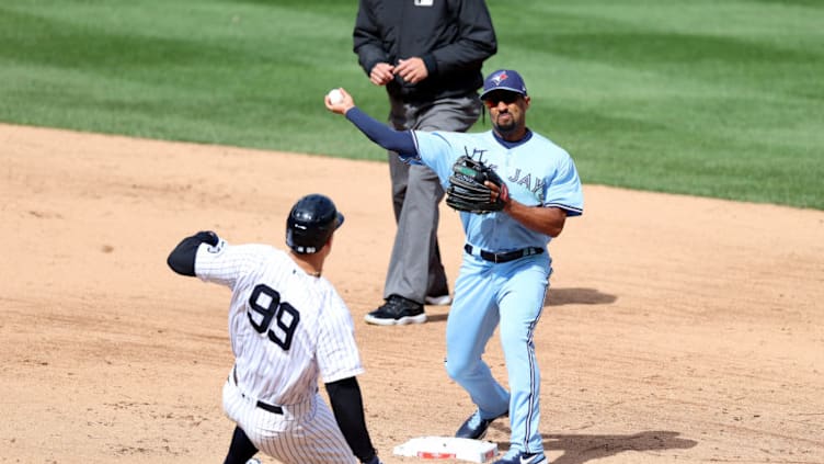 NEW YORK, NEW YORK - APRIL 01: Aaron Judge #99 of the New York Yankees is out at second base by Marcus Semien #10 of the Toronto Blue Jays during Opening Day at Yankee Stadium on April 01, 2021 in New York City. (Photo by Al Bello/Getty Images)