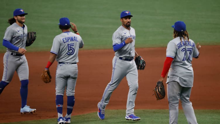 Apr 23, 2021; St. Petersburg, Florida, USA; Toronto Blue Jays shortstop Marcus Semien (10) celebrates with designated hitter Vladimir Guerrero Jr. (27) after defeating the Tampa Bay Rays at Tropicana Field. Mandatory Credit: Kim Klement-USA TODAY Sports