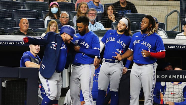 Sep 7, 2021; Bronx, New York, USA; Toronto Blue Jays designated hitter Alejandro Kirk (30) reacts with his teammates after hitting a solo home run against the New York Yankees during the eighth inning at Yankee Stadium. Mandatory Credit: Andy Marlin-USA TODAY Sports