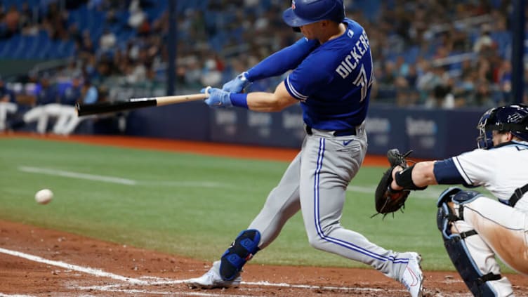 Sep 21, 2021; St. Petersburg, Florida, USA; Toronto Blue Jays left fielder Corey Dickerson (14) singles against the Tampa Bay Rays during the third inning at Tropicana Field. Mandatory Credit: Kim Klement-USA TODAY Sports