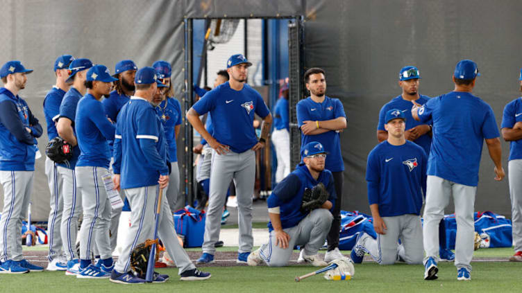 Mar 16, 2022; Dunedin, FL, USA; Toronto Blue Jays third base coach Luis Rivera (right) speaks to the infield during workouts at Toronto Blue Jays Player Development Complex. Mandatory Credit: Nathan Ray Seebeck-USA TODAY Sports