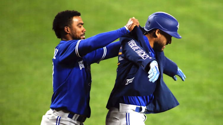 Sept. 11, 2021; Baltimore, Maryland, USA; Toronto Blue Jays center fielder George Springer (4) puts on "The Blue Jacket" after hitting a home run during the seventh inning against the Baltimore Orioles at Oriole Park at Camden Yards. Mandatory Credit: Daniel Kucin Jr.-USA TODAY Sports