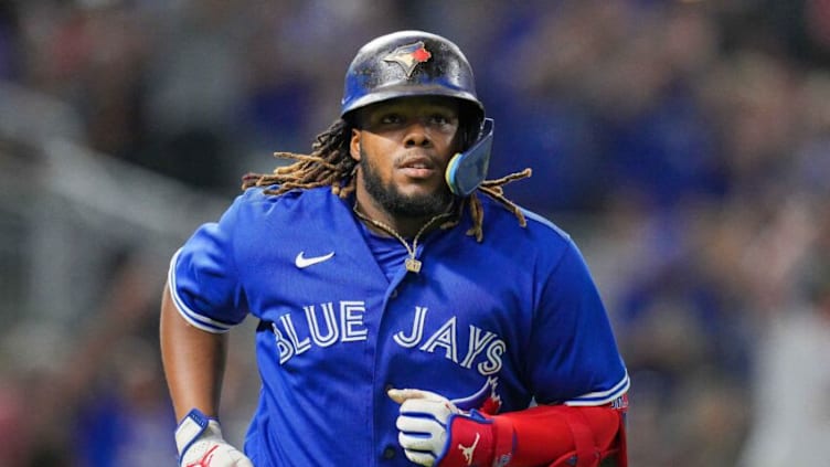 Aug 4, 2022; Minneapolis, Minnesota, USA; Toronto Blue Jays first baseman Vladimir Guerrero Jr. (27) celebrates after hitting a home run against the Minnesota Twins in the eighth inning at Target Field. Mandatory Credit: Brad Rempel-USA TODAY Sports