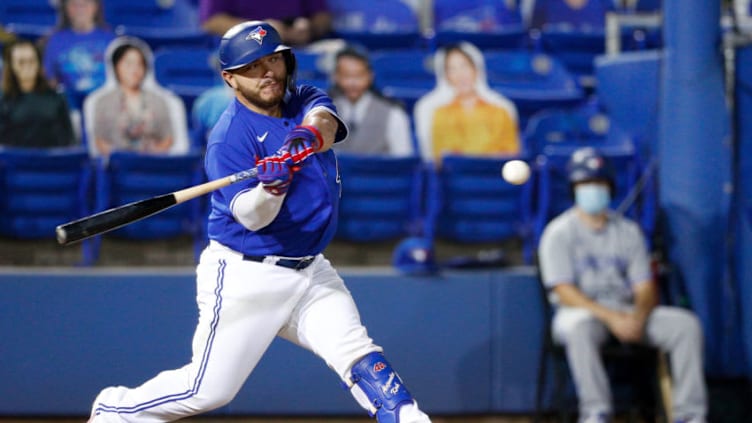 Apr 30, 2021; Dunedin, Florida, CAN; Toronto Blue Jays catcher Alejandro Kirk (30) hits a two-run home run in the fourth inning against the Atlanta Braves at TD Ballpark. Mandatory Credit: Nathan Ray Seebeck-USA TODAY Sports