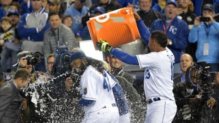 Oct 28, 2015; Kansas City, MO, USA; Kansas City Royals starting pitcher Johnny Cueto (47) is dunked with a cooler of water by catcher Salvador Perez (13) after throwing a complete game to defeat the New York Mets in game two of the 2015 World Series at Kauffman Stadium. Mandatory Credit: Denny Medley-USA TODAY Sports