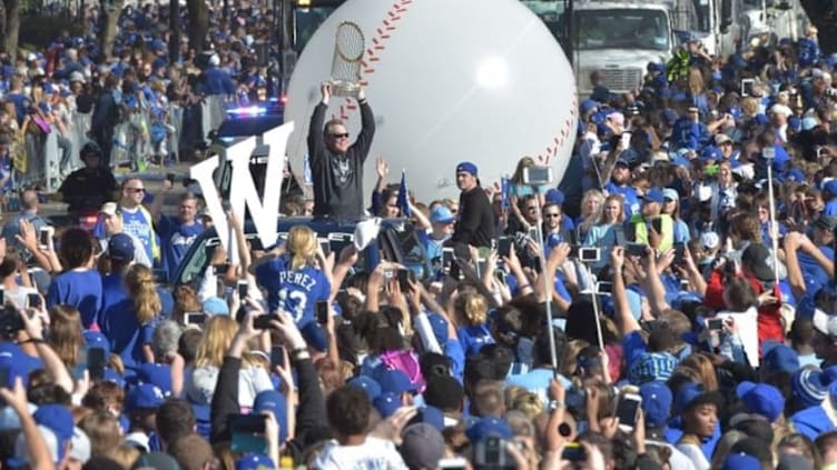 Nov 3, 2015; Kansas City, MO, USA; Kansas City Royals manager Ned Yost (3) holds the championship trophy toward fans during the parade route at Union Station. Mandatory Credit: Denny Medley-USA TODAY Sports