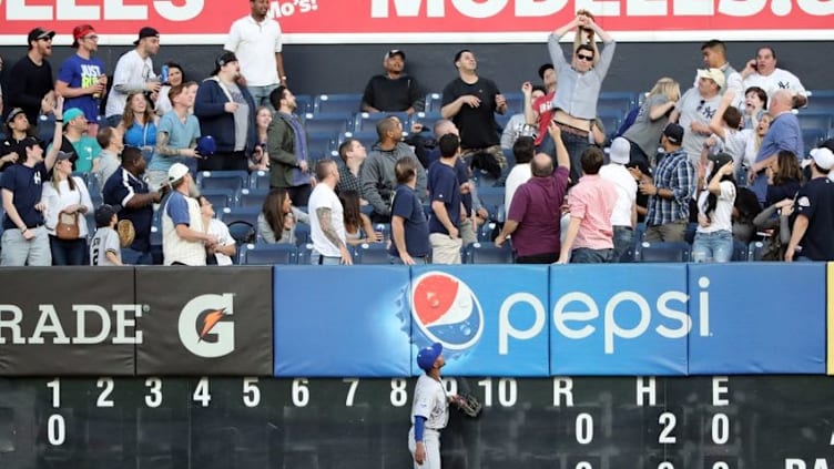 May 12, 2016; Bronx, NY, USA; Kansas City Royals center fielder Jarrod Dyson (1) watches a fan catch the home run ball hit by New York Yankees second baseman Starlin Castro (not pictured) during the first inning at Yankee Stadium. Mandatory Credit: Anthony Gruppuso-USA TODAY Sports