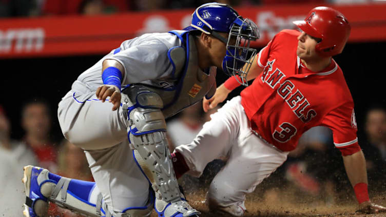 ANAHEIM, CA - JUNE 04: Ian Kinsler #3 of the Los Angeles Angels of Anaheim is tagged out at home by Salvador Perez #13 of the Kansas City Royals during the sixth inning of a game at Angel Stadium on June 4, 2018 in Anaheim, California. (Photo by Sean M. Haffey/Getty Images)