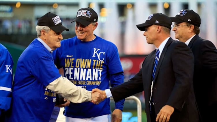 KANSAS CITY, MO - OCTOBER 15: David Glass, Owner and Chief Executive Officer of the Kansas City Royals, celebrates with manager Ned Yost