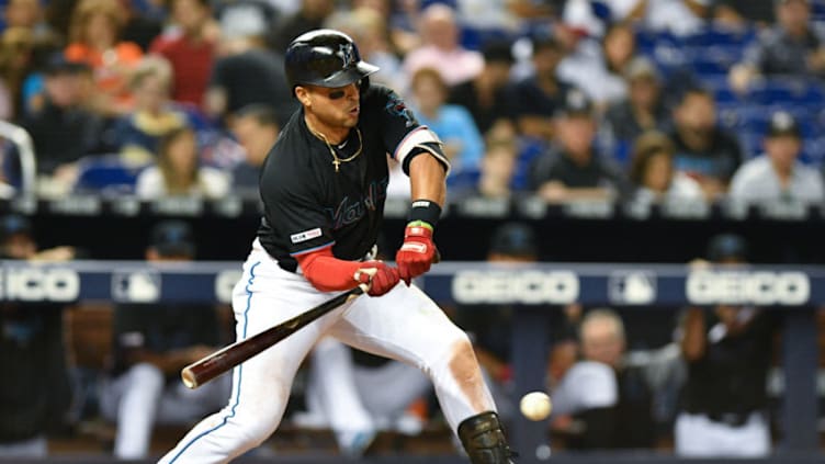 MIAMI, FL - MARCH 30: Martin Prado #14 of the Miami Marlins singles for an rbi in the seventh inning against the Colorado Rockies at Marlins Park on March 30, 2019 in Miami, Florida. (Photo by Mark Brown/Getty Images)