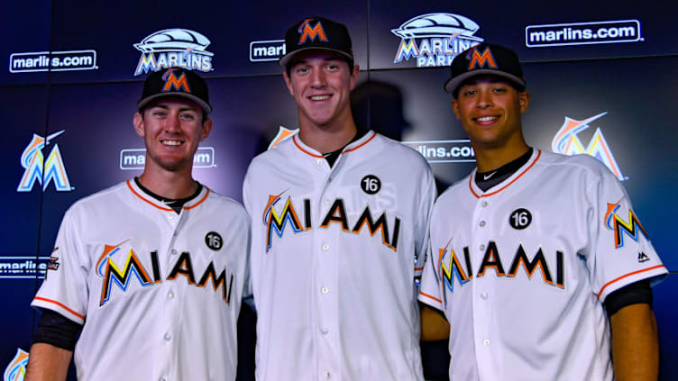 MIAMI, FL - JUNE 23: (L-R) Brian Miller, Trevor Rogers, and Joe Dunand are introduced before the game between the Miami Marlins and the Chicago Cubs at Marlins Park on June 23, 2017 in Miami, Florida. (Photo by Mark Brown/Getty Images)