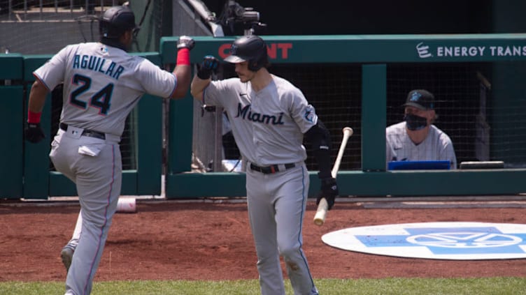 PHILADELPHIA, PA - JULY 26: Jesus Aguilar #24 of the Miami Marlins celebrates with Brian Anderson #15 after hitting a solo home run in the top of the second inning at Citizens Bank Park on July 26, 2020 in Philadelphia, Pennsylvania. The 2020 season had been postponed since March due to the COVID-19 pandemic. The Marlins defeated the Phillies 11-6. (Photo by Mitchell Leff/Getty Images)