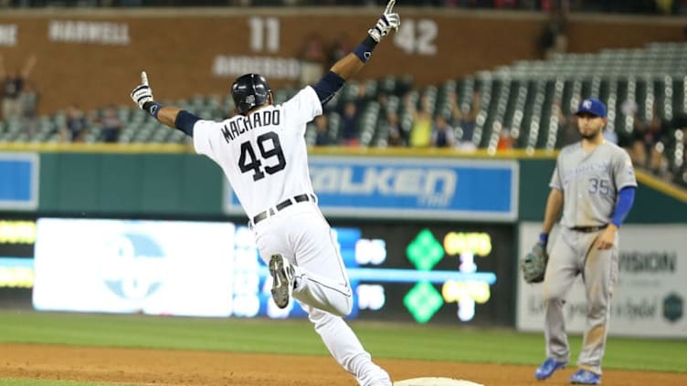 DETROIT, MI - SEPTEMBER 18: Dixon Machado #49 of the Detroit Tigers gets the game winning single in the twelfth inning and celebrate as he rounds the bases during the game against the Kansas City Royals on September 18, 2015 at Comerica Park in Detroit, Michigan. The Tigers defeated the Royals 5-4. (Photo by Leon Halip/Getty Images)