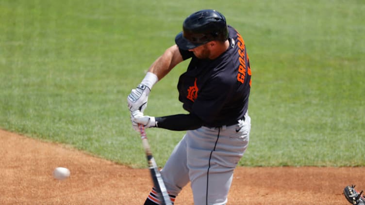 Mar 1, 2021; Tampa, Florida, USA; Detroit Tigers outfielder Robbie Grossman (8) singles against the New York Yankees during the first inning at George M. Steinbrenner Field. Mandatory Credit: Kim Klement-USA TODAY Sports