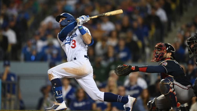 Oct 21, 2021; Los Angeles, California, USA; Los Angeles Dodgers left fielder Chris Taylor (3) hits a home run in the seventh inning against the Atlanta Braves during game five of the 2021 NLCS at Dodger Stadium. Mandatory Credit: Jayne Kamin-Oncea-USA TODAY Sports