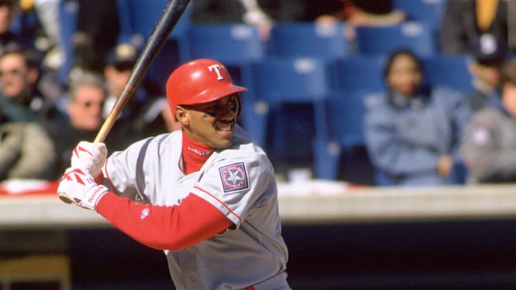 CHICAGO - CIRCA 1996: Juan Gonzalez #19 of the Texas Rangers bats during an MLB game at Comiskey Park in Chicago, Illinois. Gonzalez played for 17 years, with 4 different teams, was a 3-time All-Star and a 2-time American League MVP. (Photo by SPX/Ron Vesely Photography via Getty Images)